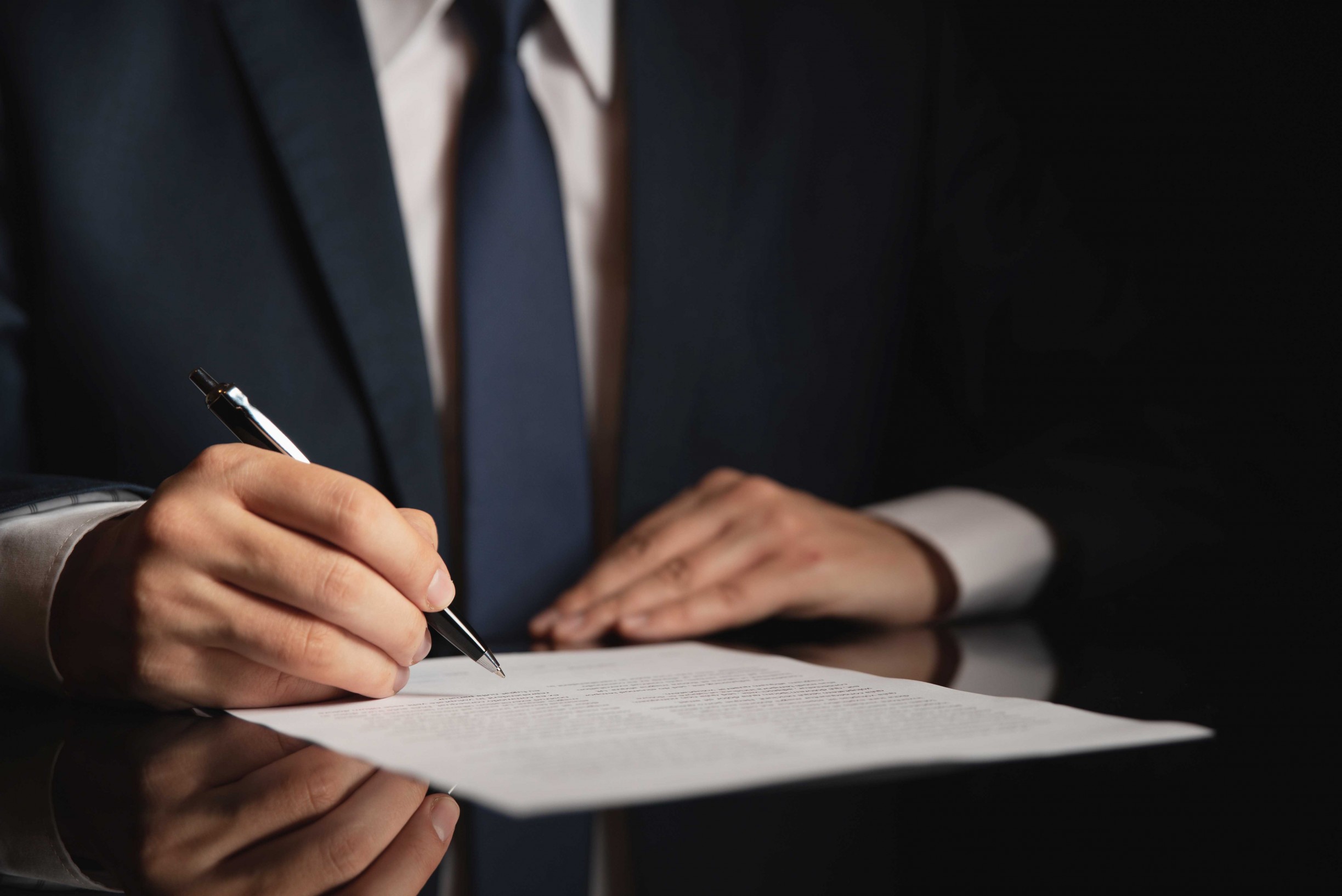 Solicitor signing a contract